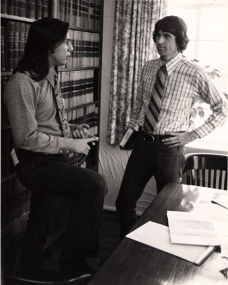 1970s photo of John Echohawk and David Getches discussing strategy