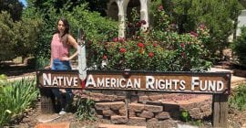 Photo of Andrea Snowball in front of NARF Boulder office