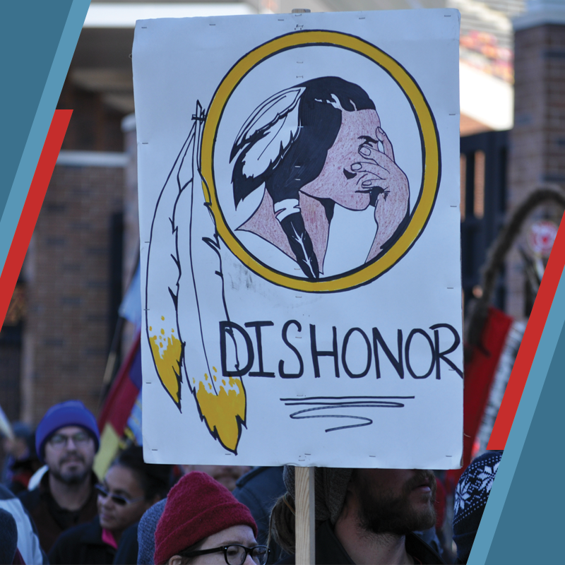 Photo of rally sign showing NFL mascot and the word dishonor