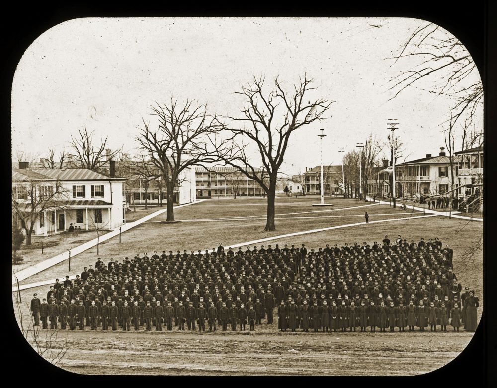 Student body gathered at Carlisle Indian Boarding School circa 1895.